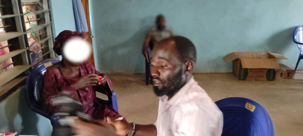 Pharm. Aondona Igyer with a patient inside the pharmacy