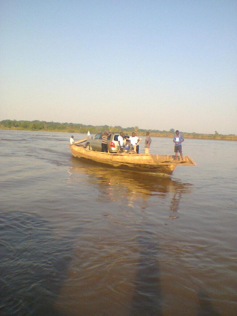 Dr. Donal Orshio and others crossing River Katsina-Ala at Buruku on the way to Abeda for the outreach