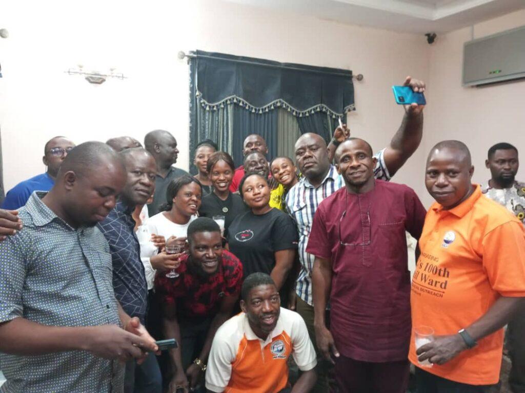 Dr. Tyoior (orange T-shirt) with a cross section of the medical team