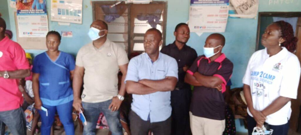 Some of the medical team members listening to an announcement